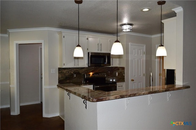 391 County Road 3150, Kempner, TX 76539 - kitchen featuring stainless steel microwave, black electric range oven, tasteful backsplash, white cabinetry, and a peninsula