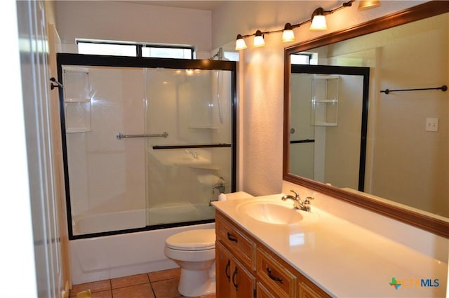 391 County Road 3150, Kempner, TX 76539 - full bathroom featuring vanity, tile patterned flooring, and enclosed tub / shower combo