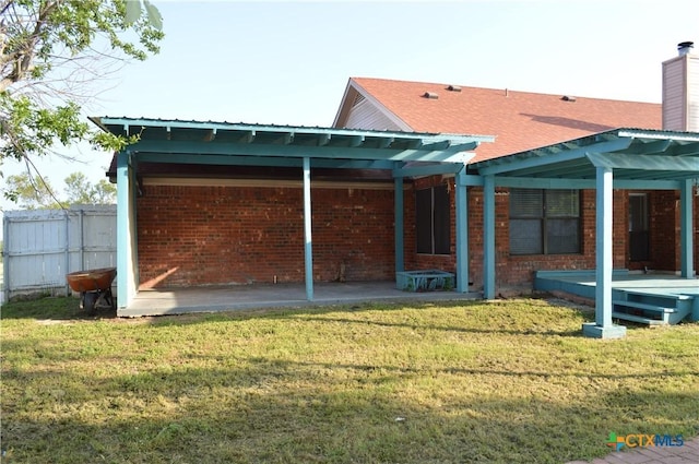 391 County Road 3150, Kempner, TX 76539 - rear view of property with brick siding and a chimney