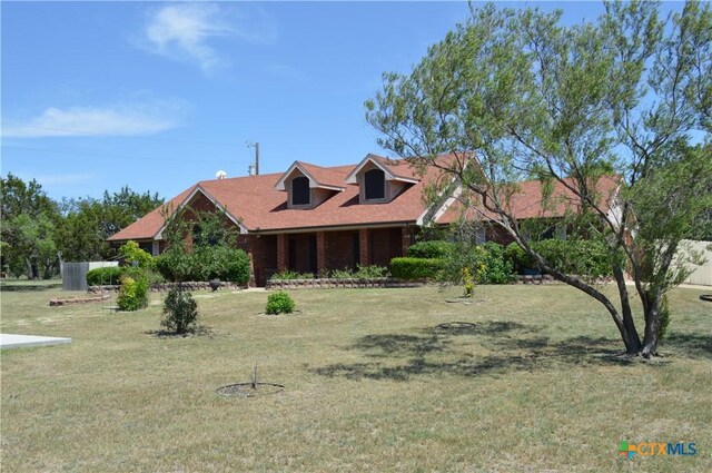 391 County Road 3150, Kempner, TX 76539 - view of front of house featuring a front yard and brick siding