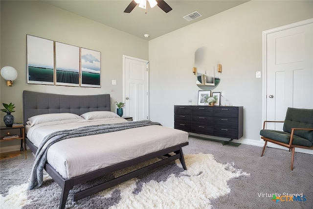 bedroom featuring light colored carpet and ceiling fan