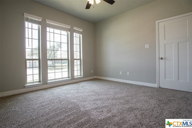 carpeted empty room with ceiling fan