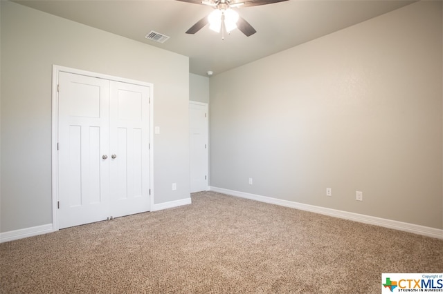 unfurnished bedroom with carpet flooring and ceiling fan