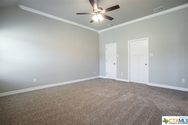 unfurnished bedroom featuring carpet floors, ceiling fan, and crown molding