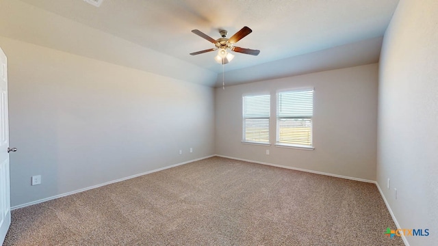 spare room featuring carpet floors and ceiling fan