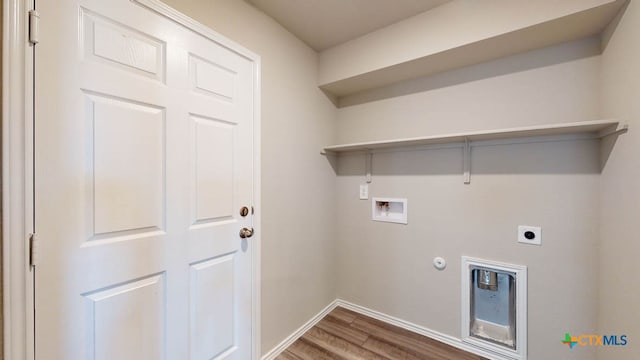 washroom featuring hookup for an electric dryer, gas dryer hookup, washer hookup, and hardwood / wood-style flooring