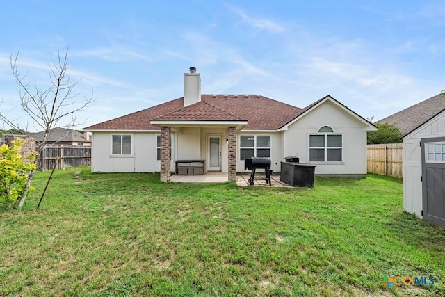 7621 Amber Meadow Loop, Temple, TX 76502 - back of property with a patio area, a chimney, and roof with shingles