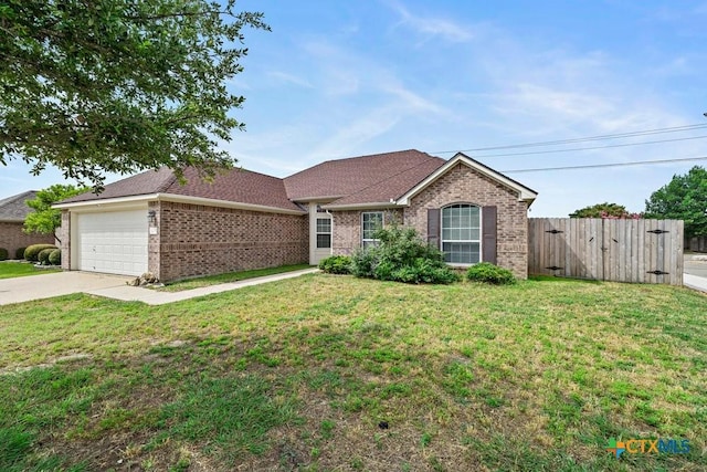 7621 Amber Meadow Loop, Temple, TX 76502 - single story home with brick siding, driveway, a garage, a gate, and roof with shingles