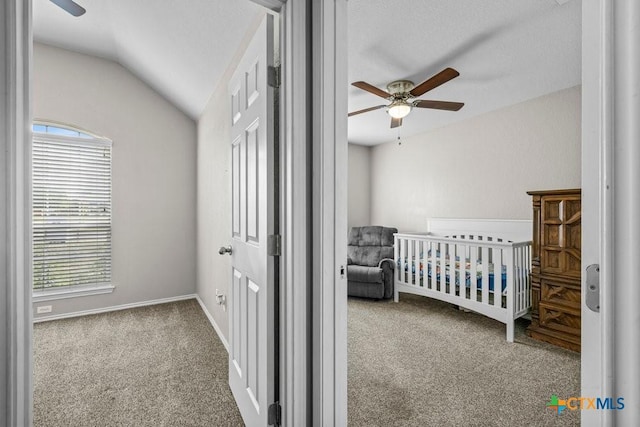 7621 Amber Meadow Loop, Temple, TX 76502 - carpeted bedroom with multiple windows, vaulted ceiling, a nursery area, baseboards, and a ceiling fan