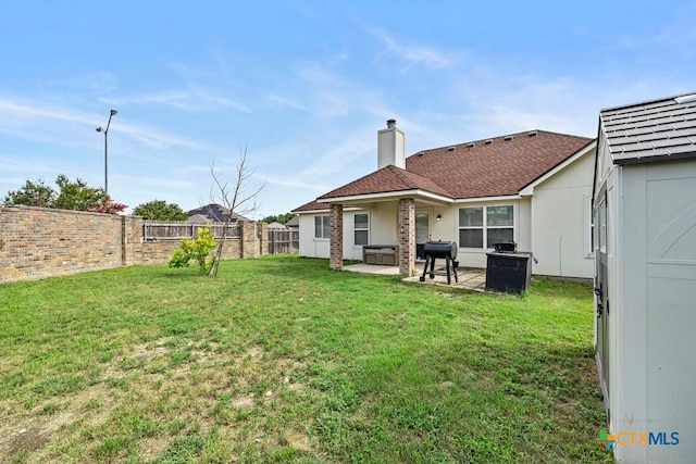 7621 Amber Meadow Loop, Temple, TX 76502 - rear view of house featuring a patio and a chimney