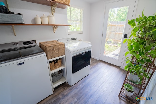 503 Maresh St, Taylor, TX 76574 - laundry area featuring wood finished floors, washer and clothes dryer, and healthy amount of natural light