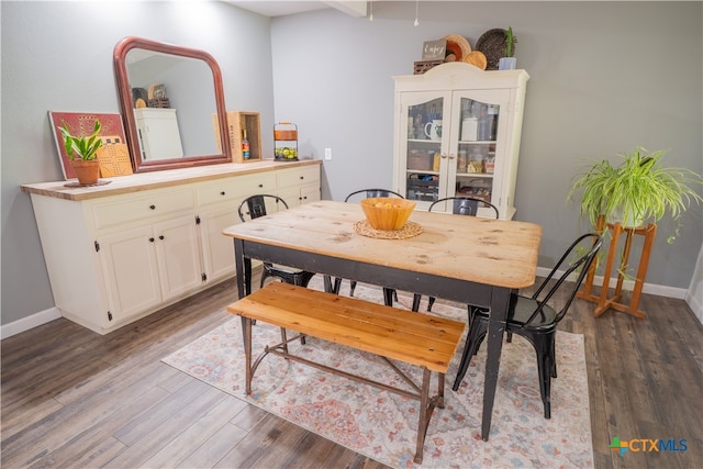 503 Maresh St, Taylor, TX 76574 - dining space featuring dark wood-type flooring and baseboards