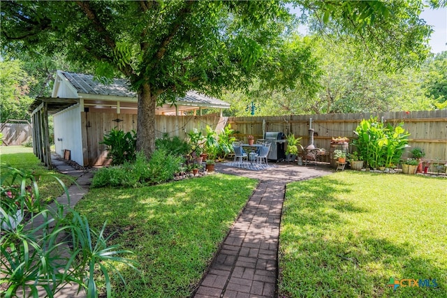 503 Maresh St, Taylor, TX 76574 - fenced backyard featuring a patio area and an outbuilding