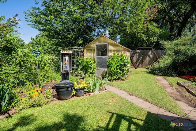 503 Maresh St, Taylor, TX 76574 - view of yard featuring a storage unit