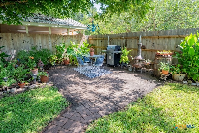 503 Maresh St, Taylor, TX 76574 - fenced backyard with grilling area and a patio area