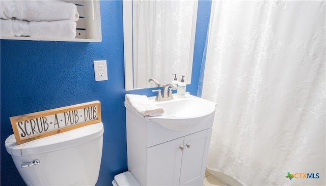 503 Maresh St, Taylor, TX 76574 - bathroom with vanity, a textured wall, and a shower with shower curtain