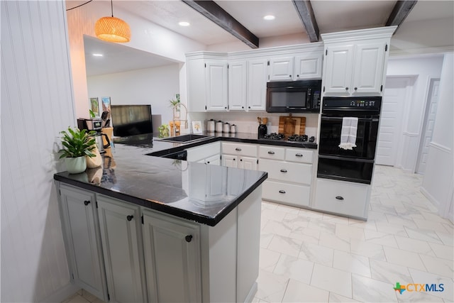 503 Maresh St, Taylor, TX 76574 - kitchen with black appliances, a warming drawer, dark countertops, beam ceiling, and a peninsula