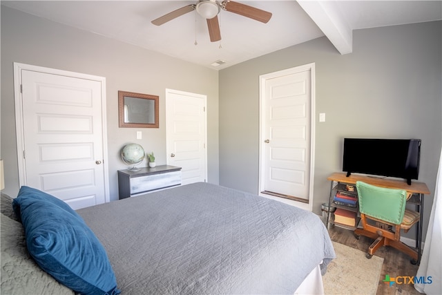 503 Maresh St, Taylor, TX 76574 - bedroom with wood finished floors, beamed ceiling, and ceiling fan