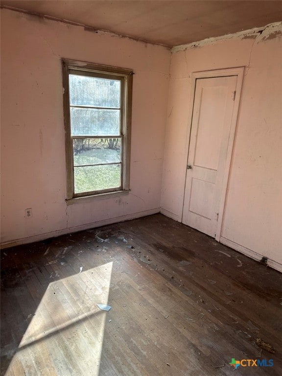 unfurnished room featuring wood-type flooring