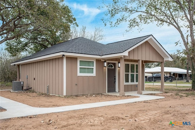 view of front of home featuring central AC unit and a porch