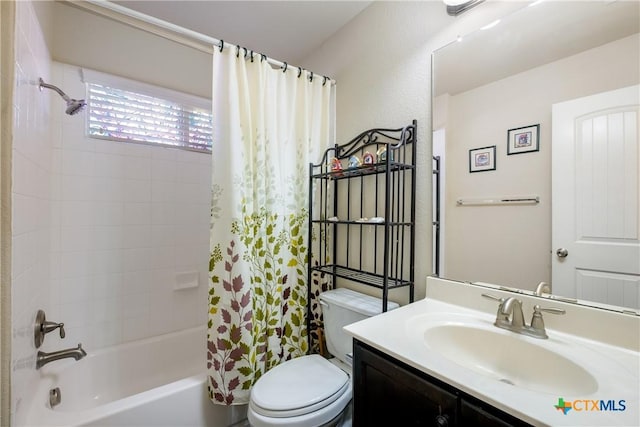 full bathroom with toilet, shower / tub combo with curtain, and vanity