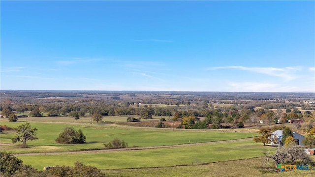 birds eye view of property with a rural view