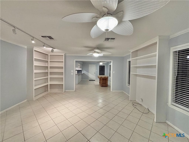 interior space featuring light tile patterned flooring, ceiling fan, ornamental molding, and built in features