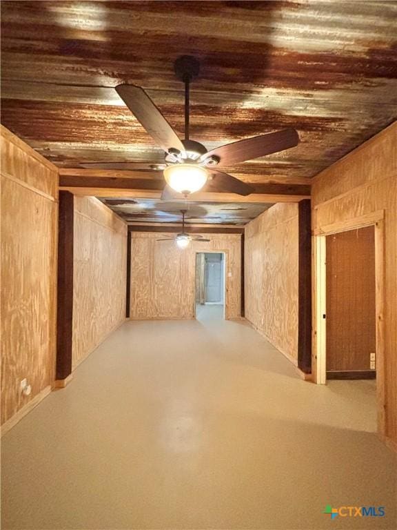 basement with wooden ceiling and ceiling fan