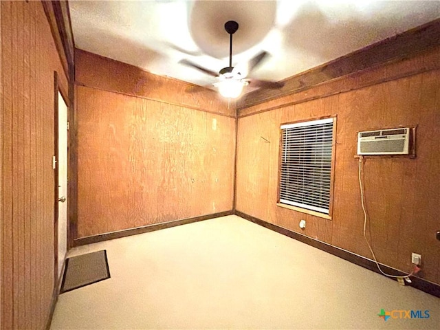 empty room featuring ceiling fan, an AC wall unit, and wooden walls