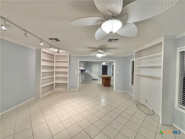 interior space featuring crown molding, built in shelves, ceiling fan, and light tile patterned flooring