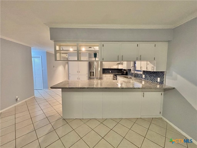 kitchen with ornamental molding, kitchen peninsula, stainless steel fridge with ice dispenser, and white cabinets