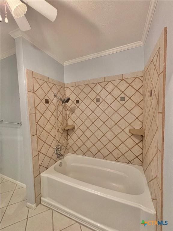 bathroom featuring tiled shower / bath combo, crown molding, and tile patterned floors