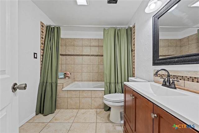 full bathroom featuring tasteful backsplash, vanity, shower / tub combo, toilet, and tile patterned floors