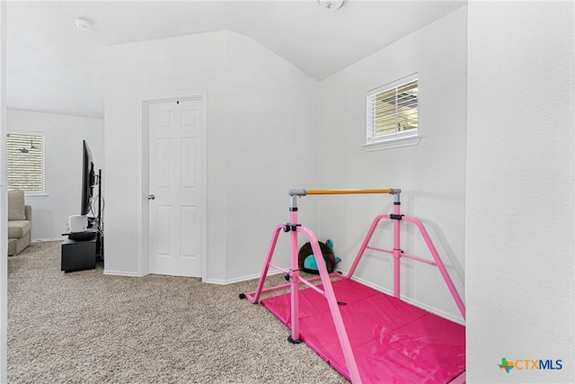 rec room featuring vaulted ceiling, carpet flooring, and baseboards