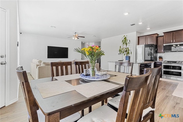 dining area with ceiling fan, light wood finished floors, visible vents, and recessed lighting