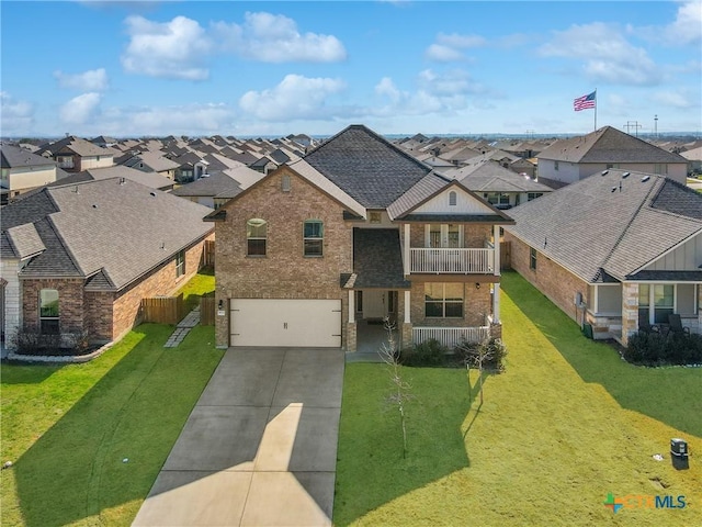 view of front of home featuring a garage, a residential view, brick siding, and a balcony