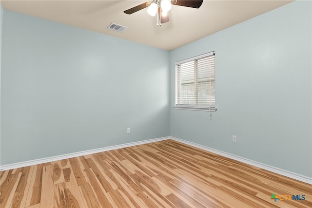 unfurnished room featuring hardwood / wood-style floors and ceiling fan