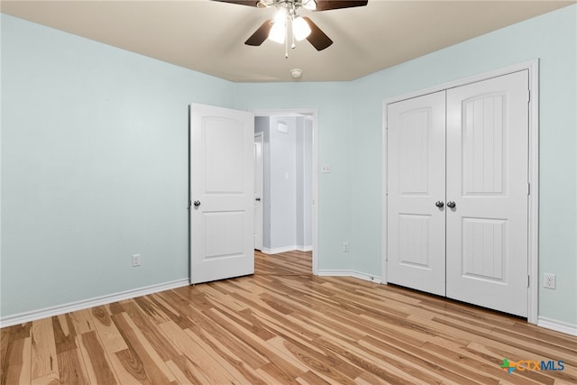 unfurnished bedroom featuring a closet, ceiling fan, and light wood-type flooring