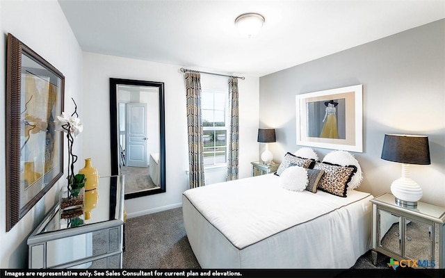 carpeted bedroom featuring baseboards
