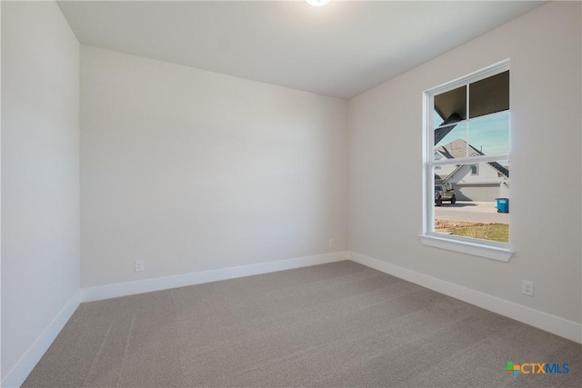 unfurnished room featuring carpet flooring