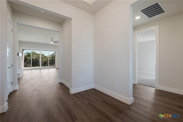 hallway featuring dark wood-type flooring