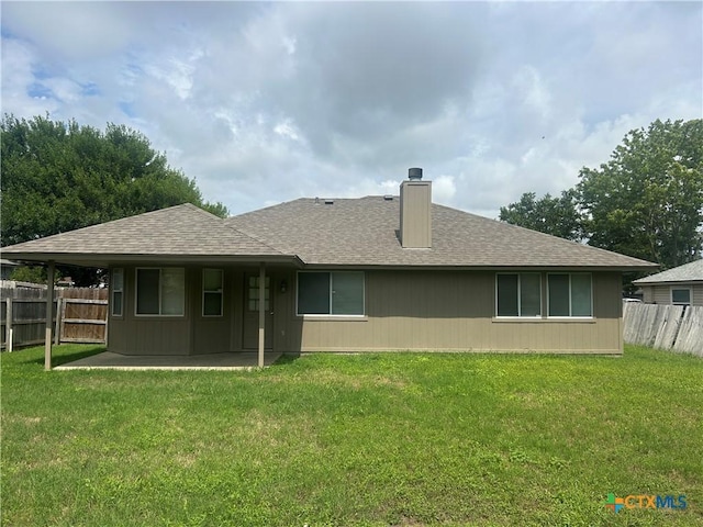 3502 Levy Ln, Killeen, TX 76542 - back of property with a shingled roof, a chimney, and a patio