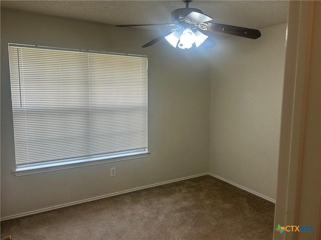 3502 Levy Ln, Killeen, TX 76542 - empty room featuring dark colored carpet, a ceiling fan, and a textured ceiling