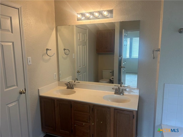 3502 Levy Ln, Killeen, TX 76542 - full bath with a textured wall and double vanity