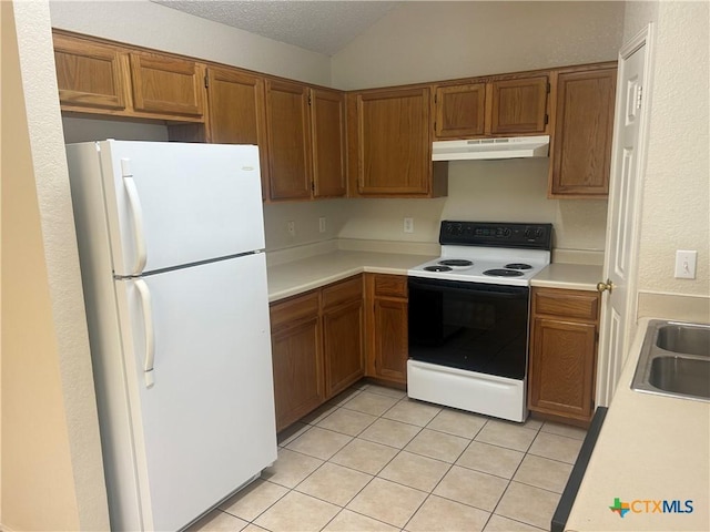 3502 Levy Ln, Killeen, TX 76542 - kitchen featuring white appliances, under cabinet range hood, brown cabinets, lofted ceiling, and a textured ceiling