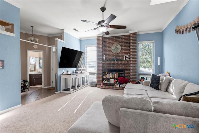 713 End O Trl, Harker Heights, TX 76548 - carpeted living area featuring crown molding, ceiling fan, and a brick fireplace