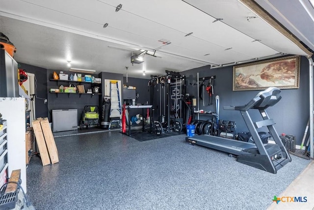 713 End O Trl, Harker Heights, TX 76548 - garage with a garage door opener and refrigerator