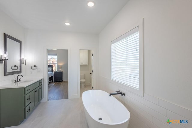 4324 Cedar Creek Rd, Temple, TX 76504 - full bath with a freestanding bath, vanity, ensuite bathroom, toilet, and recessed lighting