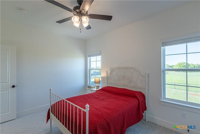 4324 Cedar Creek Rd, Temple, TX 76504 - carpeted bedroom with multiple windows, baseboards, and ceiling fan
