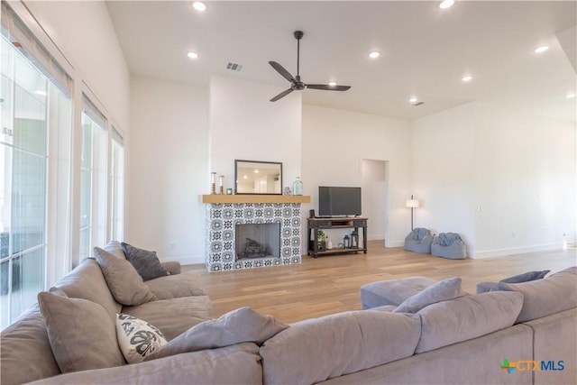 4324 Cedar Creek Rd, Temple, TX 76504 - living room featuring light wood-type flooring, baseboards, ceiling fan, recessed lighting, and a fireplace